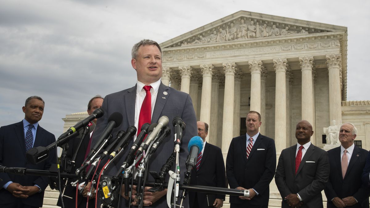 South Dakota Attorney General Jason Ravnsborg with a bipartisan group of state attorneys general speaks to reporters in front of the U.S. Supreme Court in Washington, Monday, Sept. 9, 2019.