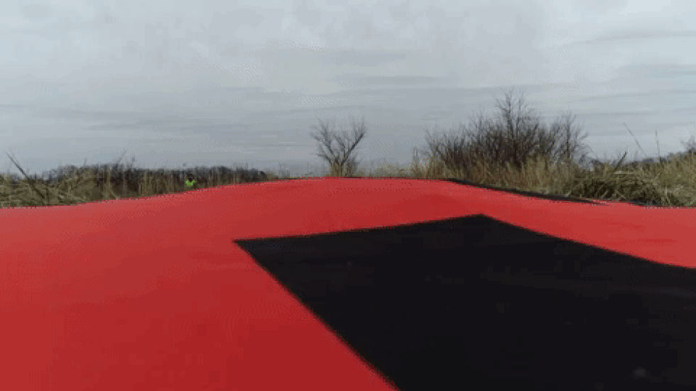 The drone rises from the launch pad to an altitude of about 50 feet.