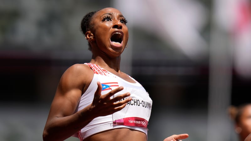 Jasmine Camacho-Quinn, of Puerto Rico, reacts after winning the women's 100-meters hurdles...