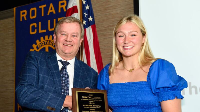 Katherine "Kat" Woodall, of Lexington Catholic, receives the Tommy Bell Award on Thursday from...