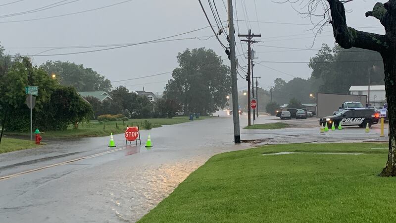 East Broadway in Mayfield, Ky. is closed and covered with flood water. This is just west of...