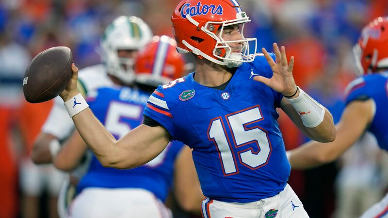 Florida quarterback Graham Mertz (15) looks to throw a pass against Charlotte during the first...
