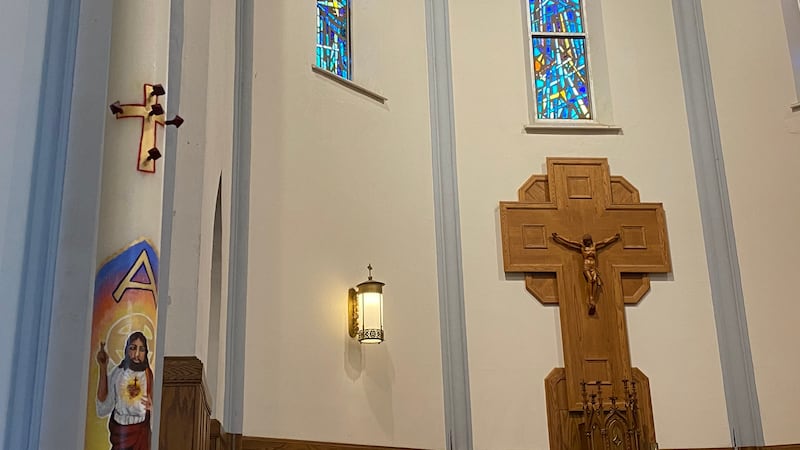 Saint Paul Catholic Church decorated its Easter candle with a depiction of the coronavirus,...