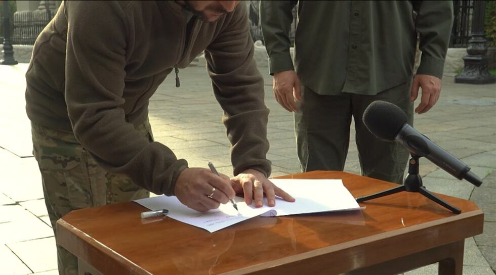 Ukrainian President Volodymyr Zelenskyy signed what he said was an accelerated application for...