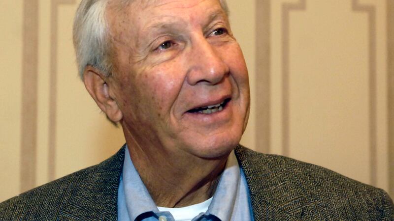 FILE - In this Dec. 6, 2005, file photo, former NCAA college football coach Pat Dye responds...