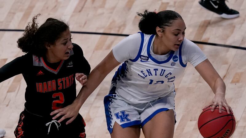 Kentucky guard Treasure Hunt (12) drives under pressure from Idaho State guard Tomekia Whitman...